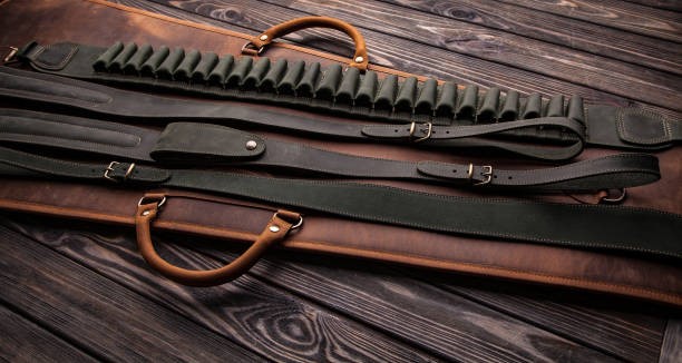Leather rifle sling attached to hunting rifle for outdoor shooting comfort and durability